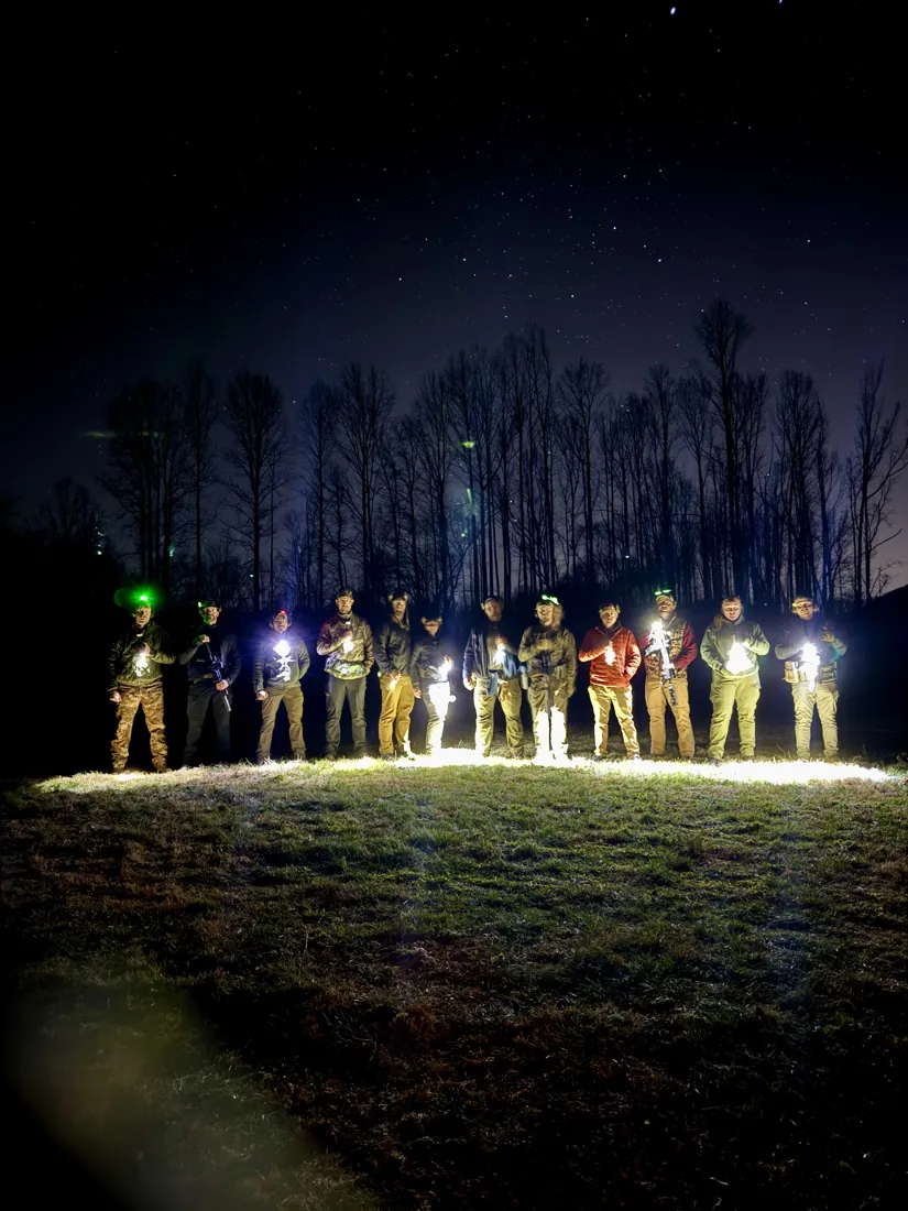 A night fire class gathered on the range after a session