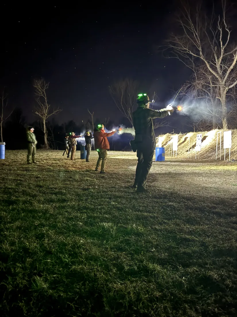 Muzzle flashes along the firing line during night training