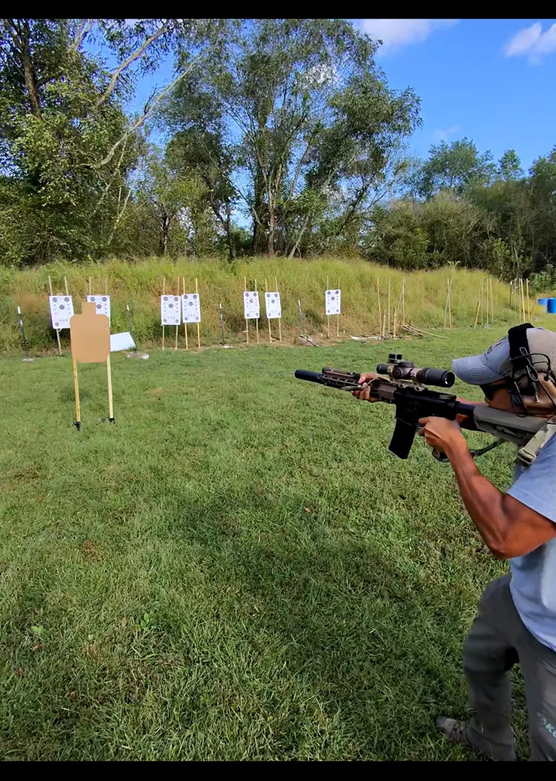 A shooter engaging a downrange steel target array